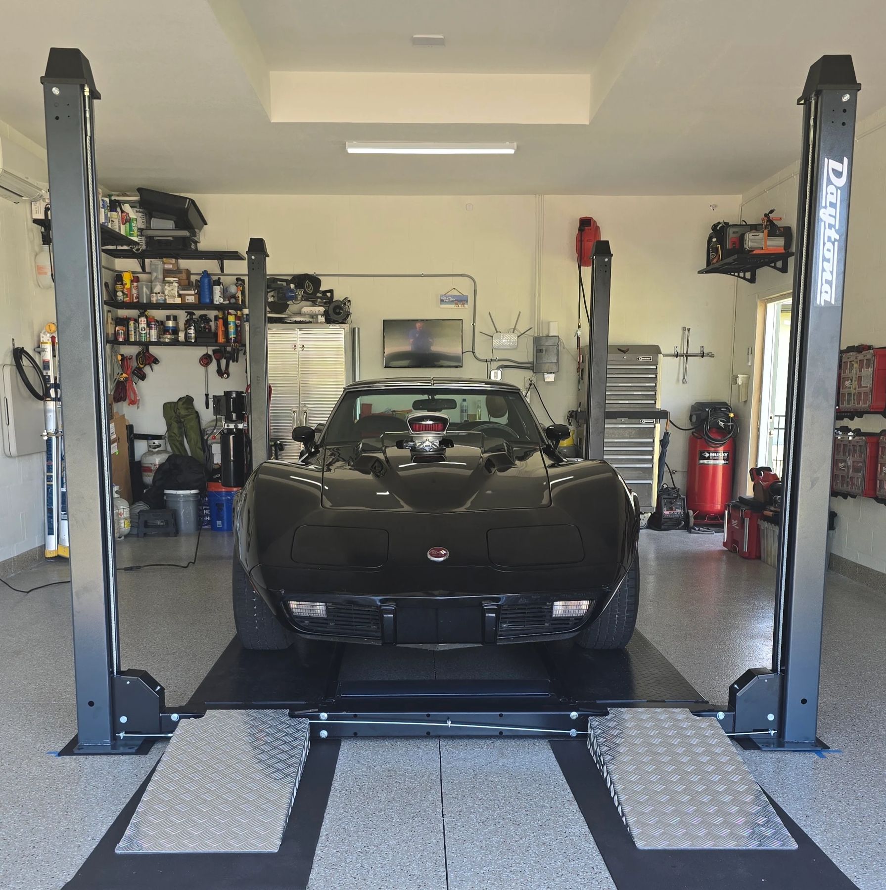 A Corvette up on the four-post lift