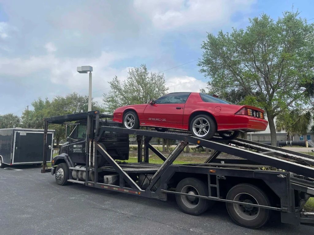 Classic car loaded on a carrier