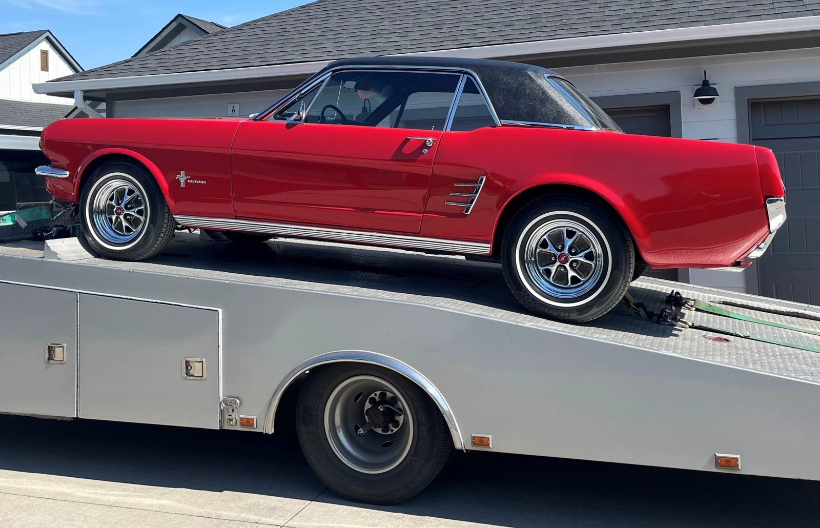 Car riding on an open trailer